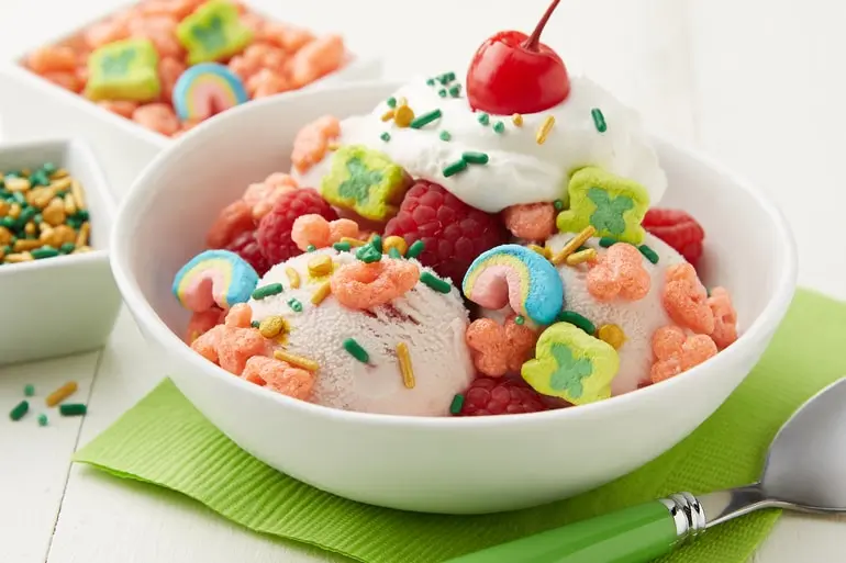 A bowl of ice cream, strawberries, blueberries and Lucky Charms™ to make the Lucky Charms™ Berry Sundae recipe.