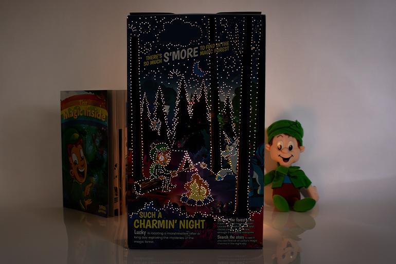 A Lucky Charms™ Cereal Box Night Light illuminated from behind in a dark setting.